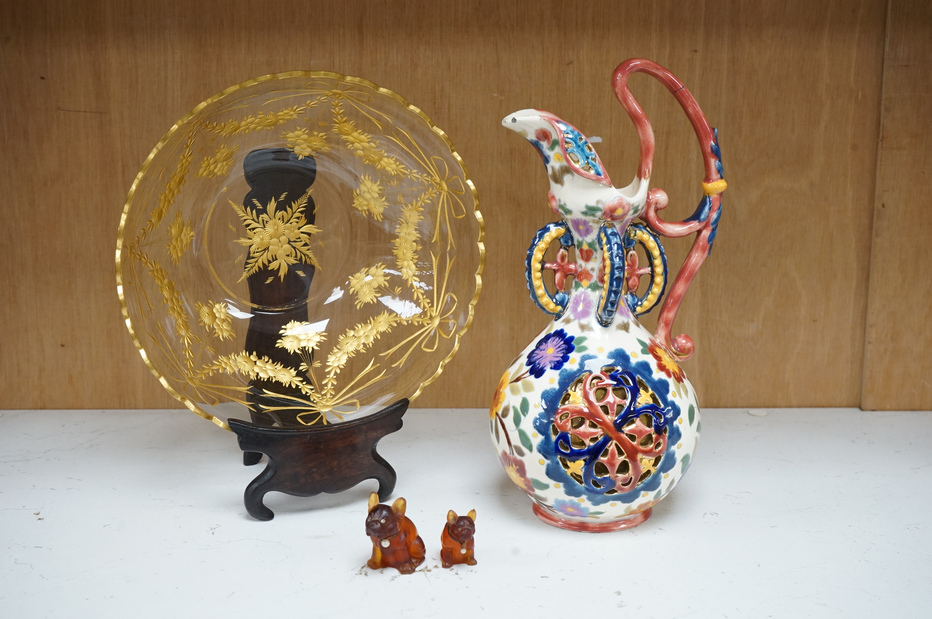 A Bohemian gilded glass bowl on stand in Zsolnay type cover and two French miniature glass dogs with pearl decorated collars, jug 25cm high